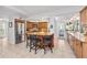 Kitchen featuring a center island with seating, stainless appliances, and ample counter space at 1235 Nelson St, Dunedin, FL 34698
