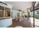 Covered lanai offers comfortable seating, ceiling fans, and a view of the sparkling pool at 1235 Nelson St, Dunedin, FL 34698