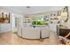 Bright living room with built-in shelving, a bay window, and comfortable seating at 1235 Nelson St, Dunedin, FL 34698