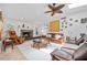 Spacious living room featuring a decorative fireplace, tiled floors, and skylight at 1235 Nelson St, Dunedin, FL 34698