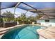 Beautiful screened-in pool and jacuzzi with covered lanai, perfect for relaxing and entertaining at 1235 Nelson St, Dunedin, FL 34698