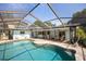 Beautiful screened-in pool with covered lanai, perfect for relaxing and entertaining at 1235 Nelson St, Dunedin, FL 34698