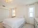 Calm bedroom featuring neutral decor, double closet, a comfortable bed and natural lighting at 1247 Overcash Dr, Dunedin, FL 34698