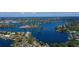 Stunning aerial view of waterfront homes nestled along winding canals and serene blue waters at 1330 Belcher Dr, Tarpon Springs, FL 34689