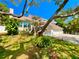 Charming two-story home with lush landscaping and a well-maintained lawn in a desirable neighborhood at 1330 Belcher Dr, Tarpon Springs, FL 34689