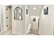 Hallway view featuring a mirror and access to an eat-in kitchen at 1330 Belcher Dr, Tarpon Springs, FL 34689