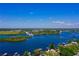 Beautiful waterfront property with boat lifts surrounded by scenic views of the water and lush vegetation at 1330 Belcher Dr, Tarpon Springs, FL 34689