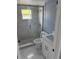 Bathroom featuring a tiled shower, toilet, and a vanity at 13314 Lisa Dr, Hudson, FL 34667