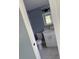 This is a bathroom featuring white fixtures, tiled floor, vanity, and mirror at 13314 Lisa Dr, Hudson, FL 34667
