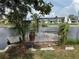 Property with a dock and boat lift in a serene canal setting at 13314 Lisa Dr, Hudson, FL 34667
