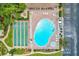 Aerial view showcasing a beautiful pool, shuffleboard, and well-maintained grounds at 14130 Rosemary Ln # 4115, Largo, FL 33774