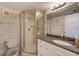 Bathroom with granite countertop vanity and tiled glass-enclosed shower at 14130 Rosemary Ln # 4115, Largo, FL 33774