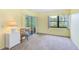Bedroom featuring a sliding glass door to outdoor sitting area and beautiful view at 14130 Rosemary Ln # 4115, Largo, FL 33774