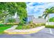 Charming clubhouse featuring well-manicured landscaping and beautiful curb appeal at 14130 Rosemary Ln # 4115, Largo, FL 33774