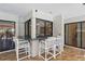 Outdoor wet bar with seating and pass-through window to the kitchen offers seamless indoor/outdoor living at 14168 Fennsbury Dr, Tampa, FL 33624