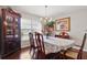 Elegant dining room featuring hardwood floors, a chandelier, and ample natural light at 14168 Fennsbury Dr, Tampa, FL 33624