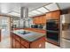 Spacious kitchen features a large island, stainless steel appliances, and lots of cabinet space at 14168 Fennsbury Dr, Tampa, FL 33624
