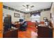 Home office featuring hardwood floors, dual desks, lots of decor and natural lighting at 14168 Fennsbury Dr, Tampa, FL 33624