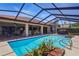 Inviting in-ground pool area features a screened enclosure and is conveniently located near the patio at 14168 Fennsbury Dr, Tampa, FL 33624