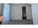 This spacious bedroom features neutral paint and carpet with an en suite bathroom at 14667 Pine Glen Crk # 14667, Lutz, FL 33559