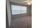 Neutral-toned bedroom featuring a ceiling fan and natural light that creates a calm, relaxing atmosphere at 14667 Pine Glen Crk # 14667, Lutz, FL 33559