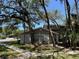 Charming two-story home featuring mature trees and manicured lawn, nestled in a peaceful neighborhood at 14667 Pine Glen Crk # 14667, Lutz, FL 33559