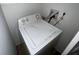 Amana brand washing machine with dials sits in the laundry area of the home at 14667 Pine Glen Crk # 14667, Lutz, FL 33559