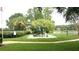Community playground with equipment including a slide and climbing bars at 14667 Pine Glen Crk # 14667, Lutz, FL 33559