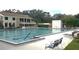 Inviting swimming pool surrounded by lounge chairs and lush greenery, perfect for relaxation and recreation at 14667 Pine Glen Crk # 14667, Lutz, FL 33559