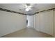 Bedroom features a ceiling fan, neutral carpeting, and closet at 15006 Shaw Rd, Tampa, FL 33625
