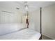 Bright bedroom featuring a ceiling fan, closet, and doorway at 15006 Shaw Rd, Tampa, FL 33625