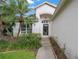 Close up on the front exterior and entrance of the home with a black front door at 15006 Shaw Rd, Tampa, FL 33625