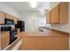 Spacious kitchen with wooden cabinets, modern appliances, and ample counter space at 15006 Shaw Rd, Tampa, FL 33625