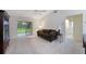 Bright living room featuring sliding doors to the outside and neutral carpeting at 15006 Shaw Rd, Tampa, FL 33625