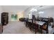 Open floor plan with a dining room and living room, featuring a sliding glass door to the patio at 15006 Shaw Rd, Tampa, FL 33625