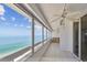 Outdoor balcony with tiled floor overlooking the ocean and beach front at 17900 Gulf Blvd # 16C, Redington Shores, FL 33708