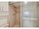 Bathroom shower featuring neutral tiling and updated fixtures with glass door at 17900 Gulf Blvd # 16C, Redington Shores, FL 33708