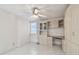 Bright bedroom featuring built-in cabinets, drawers, and a ceiling fan at 17900 Gulf Blvd # 16C, Redington Shores, FL 33708