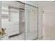 Walk in closet with mirror slider door and custom shelving and drawer system at 17900 Gulf Blvd # 16C, Redington Shores, FL 33708