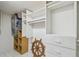 Walk-in closet with built-in shelving, drawers, and an accent helm decoration at 17900 Gulf Blvd # 16C, Redington Shores, FL 33708