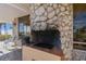 Outdoor stone fireplace with a grill next to the beach at 17900 Gulf Blvd # 16C, Redington Shores, FL 33708