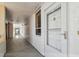 Exterior condo hallway showing unit entry door with number and peephole at 17900 Gulf Blvd # 16C, Redington Shores, FL 33708