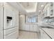 Spacious kitchen features white cabinets and appliances at 17900 Gulf Blvd # 16C, Redington Shores, FL 33708