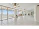 Large living room featuring a wall of sliding glass doors with ocean views at 17900 Gulf Blvd # 16C, Redington Shores, FL 33708