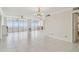 Spacious living room with tile flooring and sliding doors to a balcony at 17900 Gulf Blvd # 16C, Redington Shores, FL 33708
