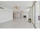 Light filled living room with fireplace, tile floors and views to the outdoor balcony at 17900 Gulf Blvd # 16C, Redington Shores, FL 33708