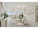 Bright and airy living room with floor-to-ceiling windows and access to a balcony at 17900 Gulf Blvd # 16C, Redington Shores, FL 33708