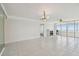 Spacious living room with tiled flooring, fireplace and doors leading to a balcony with a view at 17900 Gulf Blvd # 16C, Redington Shores, FL 33708