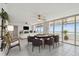 Bright living space featuring fireplace, TV, poker table and glass doors to the balcony at 17900 Gulf Blvd # 16C, Redington Shores, FL 33708