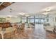 Bright lobby area featuring tile floors and chairs with views of the beach through large sliding glass doors at 17900 Gulf Blvd # 16C, Redington Shores, FL 33708